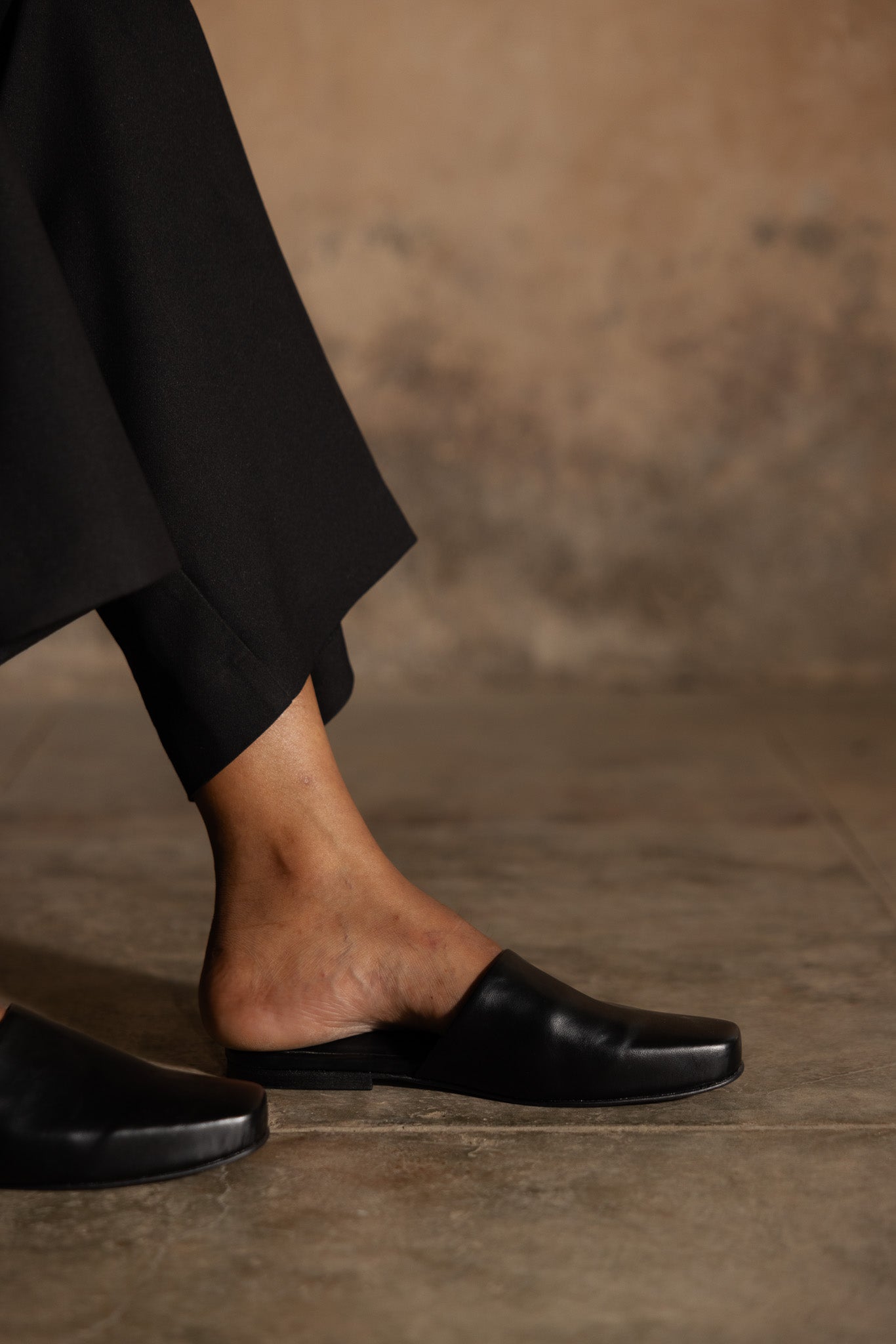 trendy and comfortable black slip-ons for women
